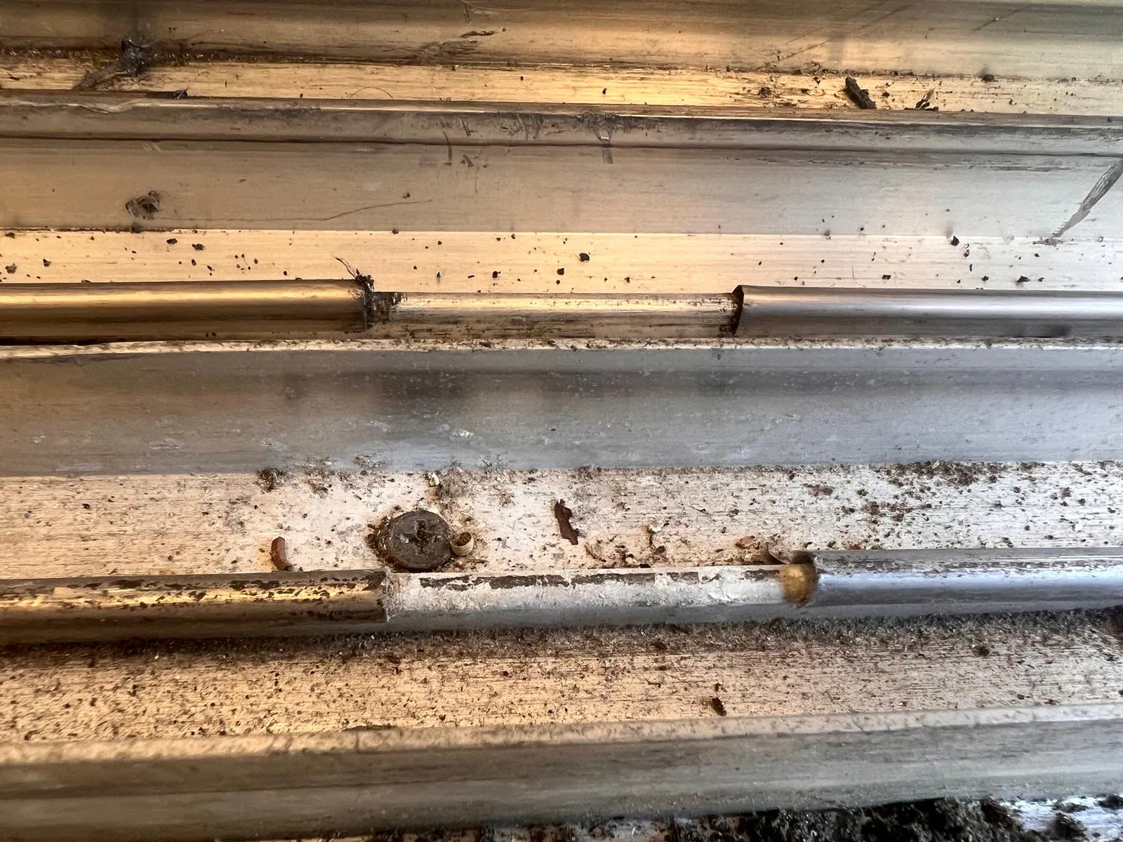 Damaged track end cap being replaced during sliding door repair service